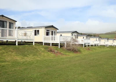 row of caravans by a welsh coastline